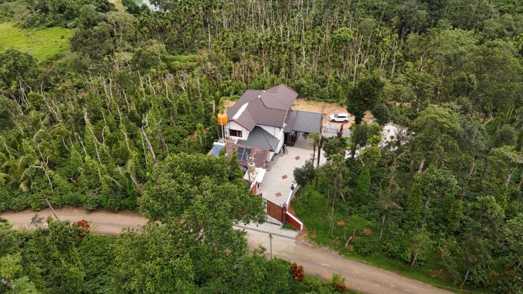an aerial view of a house in the forest at Greenview Homestay in Sakleshpur