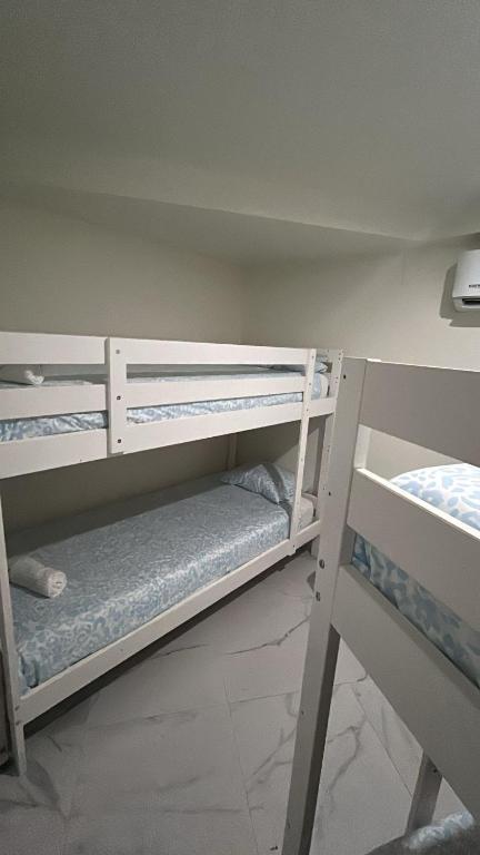 a room with two bunk beds in a room at Casa El Viso in Madrid