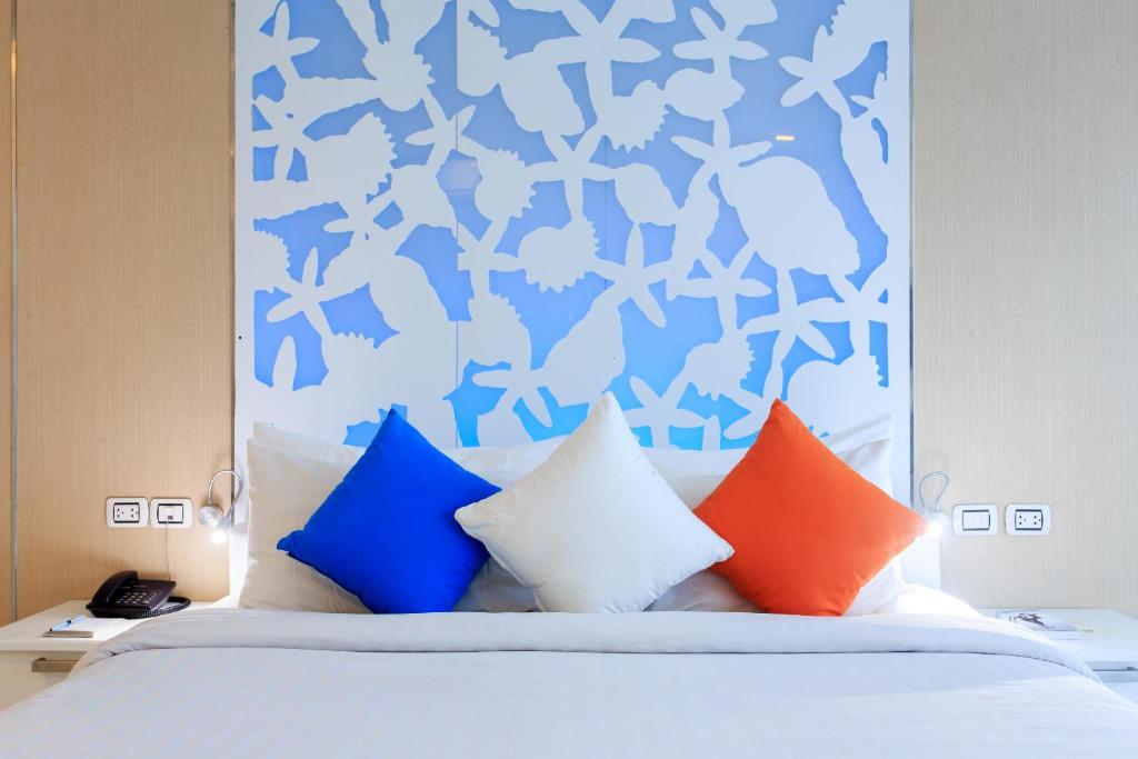 Postel nebo postele na pokoji v ubytování Samui Resotel Beach Resort