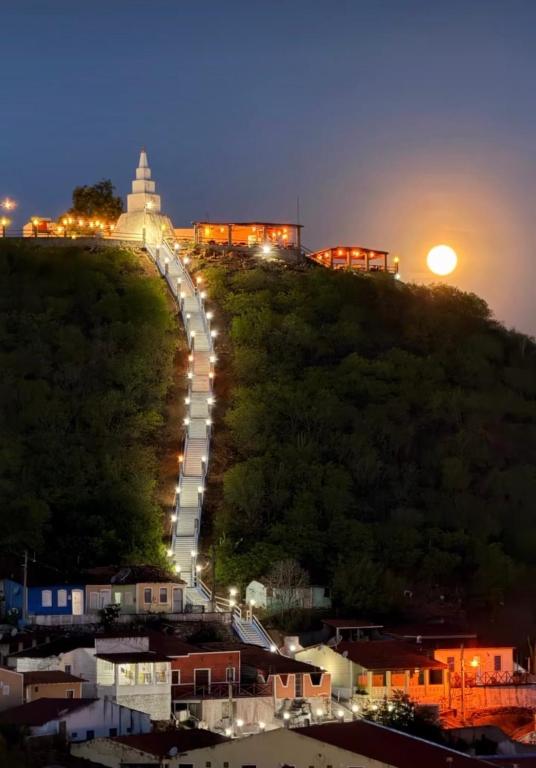 a road on the side of a hill at night at Recanto Sole Luz in Piranhas