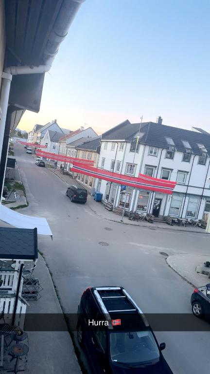 a car parked in a parking lot next to a building at Rosahuset in Kabelvåg