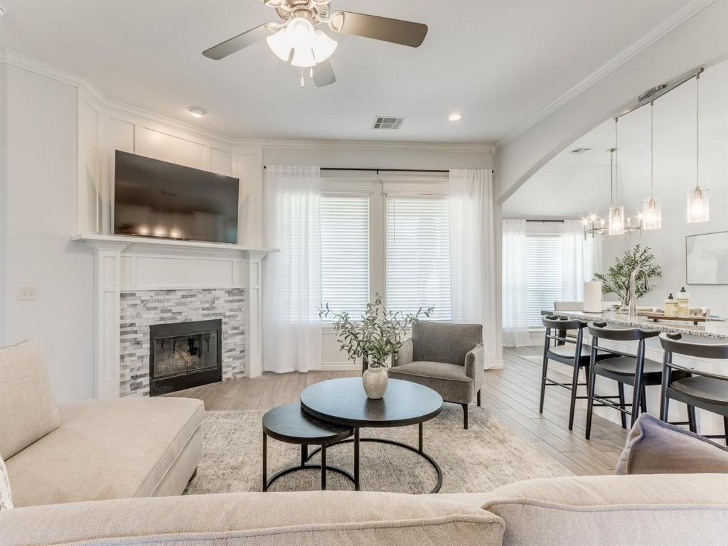 a living room with a couch and a table at Spacious Modern Comfort Fabulous 15th! in Moore