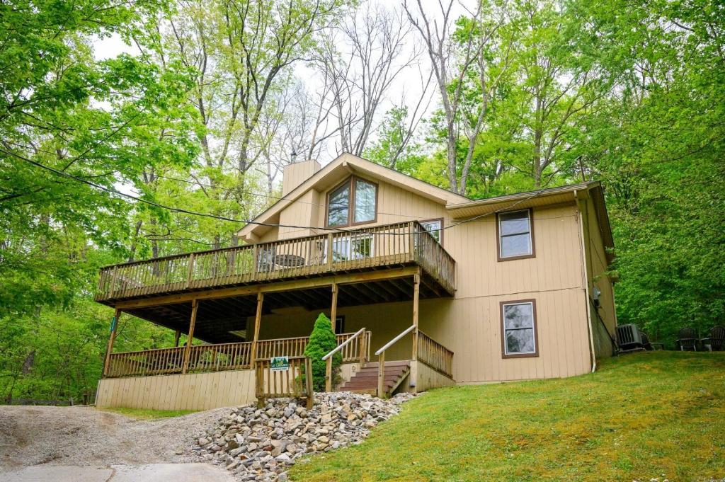 a large house with a balcony on top of it at Moonbeam Chalet in Logan