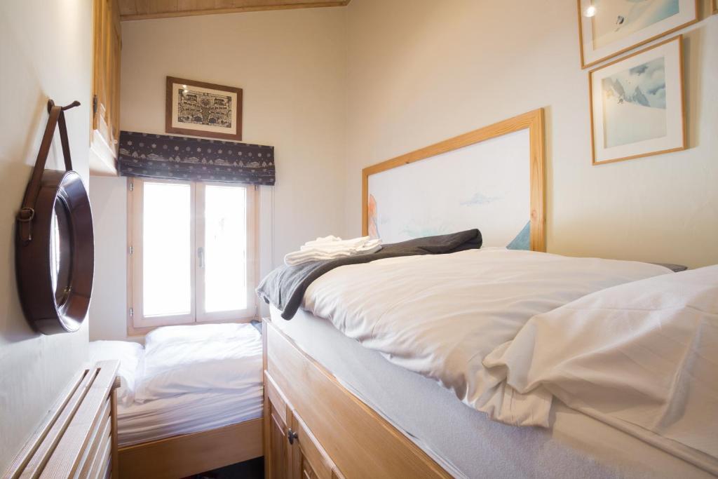Postel nebo postele na pokoji v ubytování Apartments Roxes