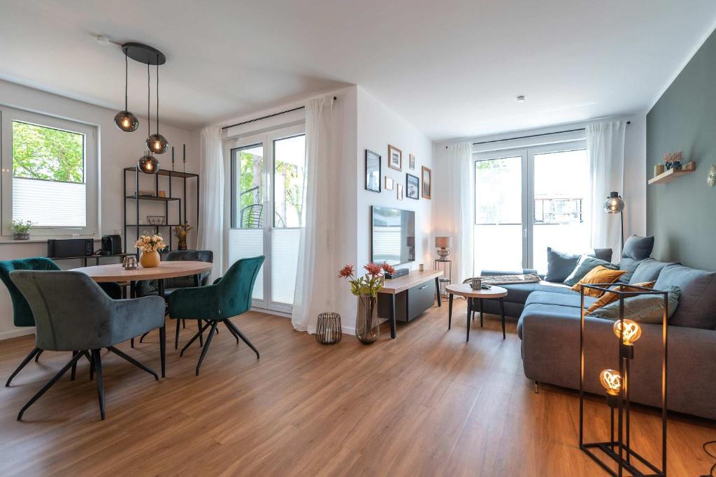 a living room with a couch and a table at Haffhafen in Garz