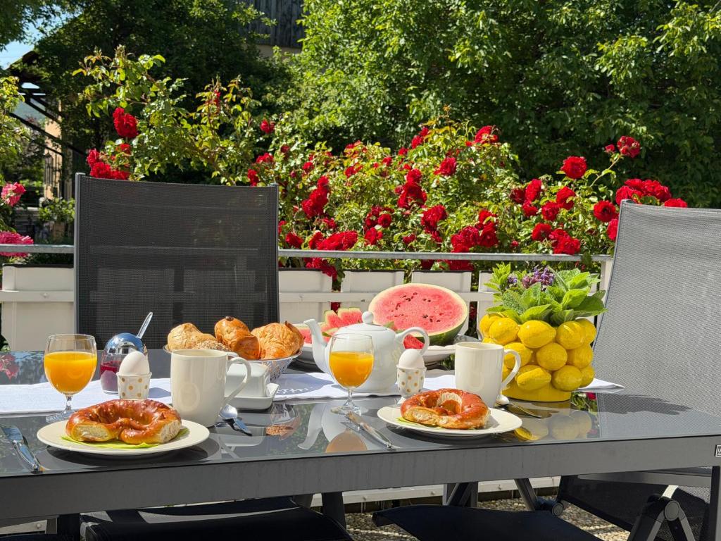 a table with breakfast foods and drinks on it at Ferienwohnung Sieglinde in Bad Dürrheim