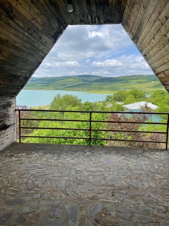 a view from the inside of a building looking out at the water at Lake View Sioni in Sioni