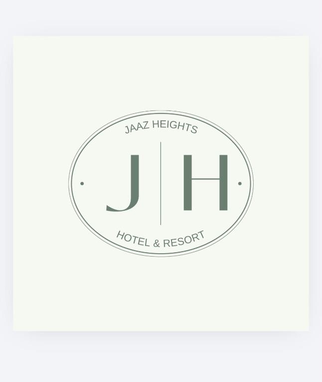 a round logo for a hotel and resort at Jaaz Heights in Tāl