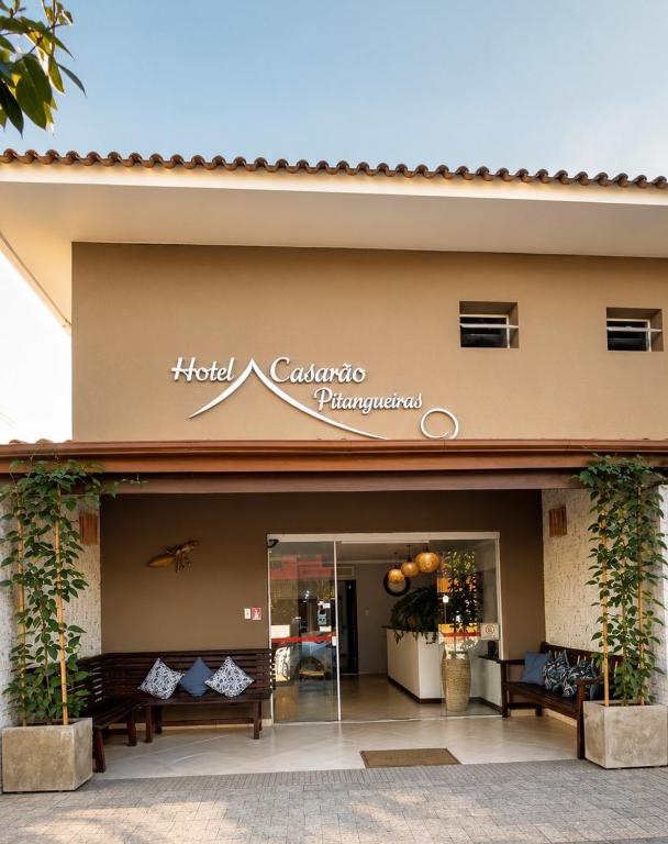 a store front of a hotel cancanta pharmacy at Hotel Casarão Pitangueiras in Guarujá