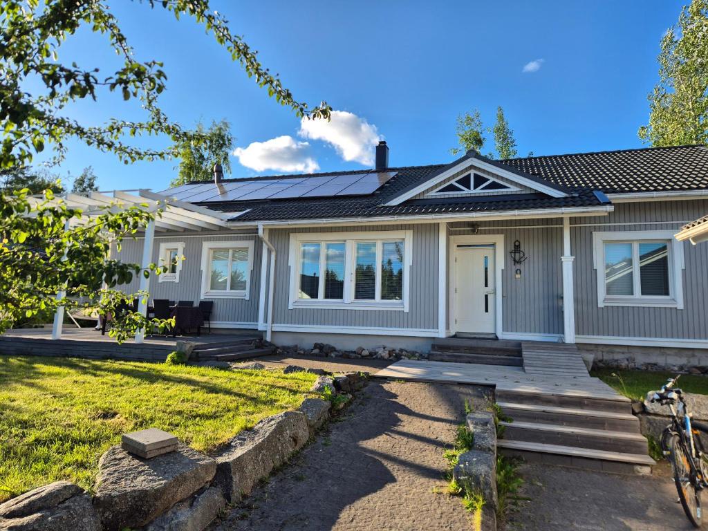 a home with a gray house at Villa Herttala in Jyväskylä
