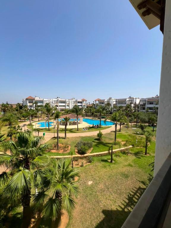 an aerial view of a park with a swimming pool at Marina golf A in Asilah
