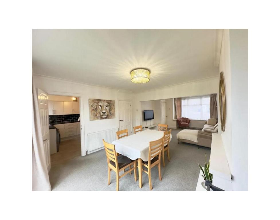a dining room and living room with a table and chairs at Wunderschönes Chalet in Oberstdorf mit Berg in Oberstdorf