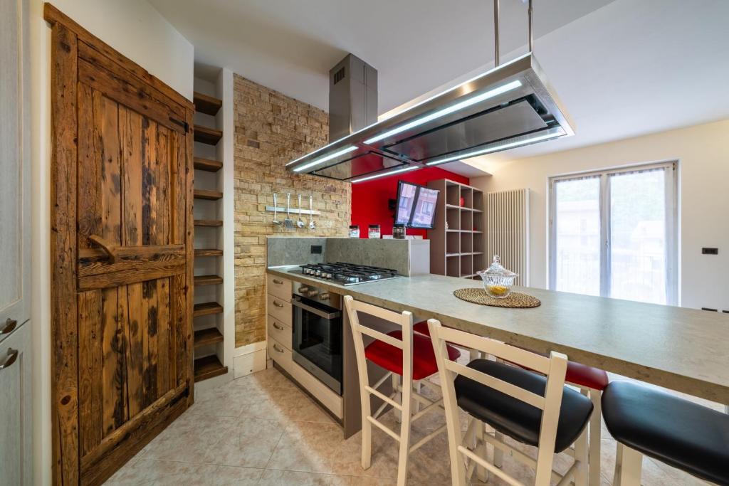 a kitchen with a counter and a stove top oven at Casa Gradita in Ponte Caffaro