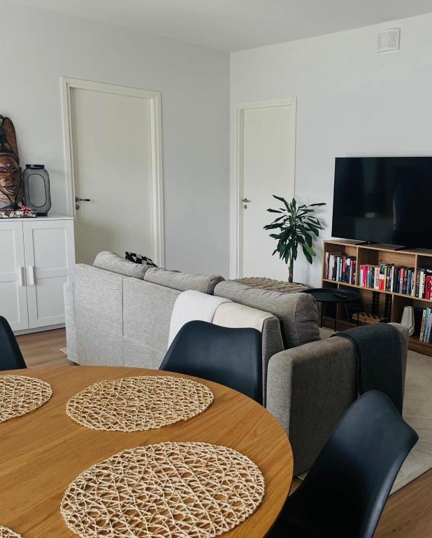 a living room with a couch and a table at The Cozy Corner in Turku