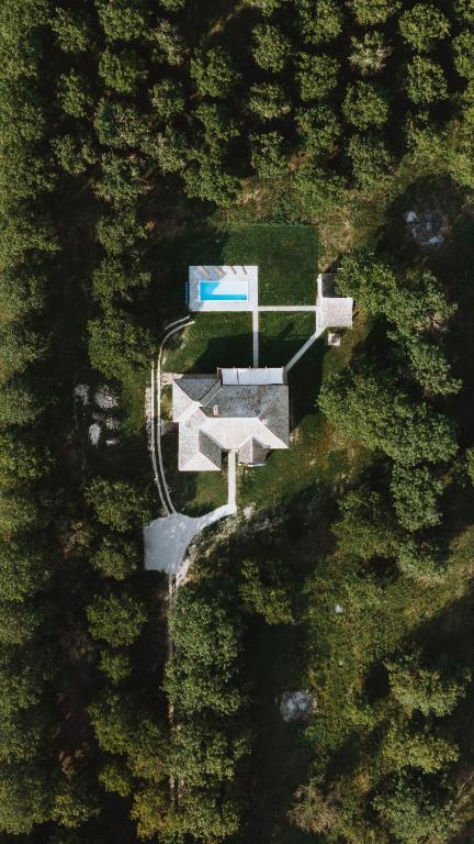 an overhead view of a house in a forest at Nizija in Sombor