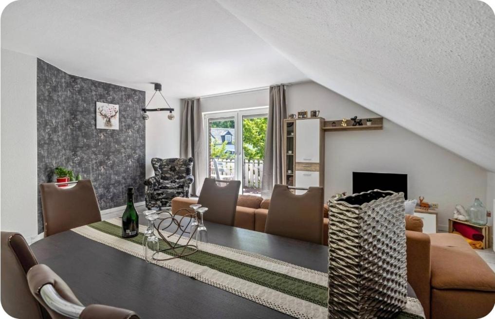 a living room with a couch and a table at Kahler Pőn in Willingen