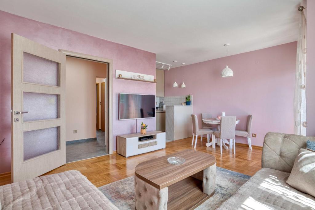 a living room with a couch and a table at V&V apartment in Podgorica