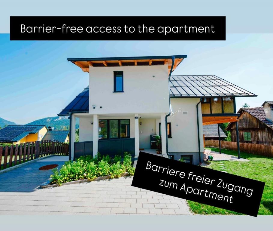 a house with a sign in front of it at Sepperls Stubn Apartment - Bad Goisern - 24-hours Self check-in in Bad Goisern
