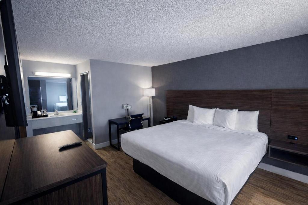 a hotel room with a large bed and a desk at Chicago Lakeshore Hotel in Chicago