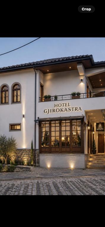 a building with a hotel guimaraoliseria sign on it at Hotel Gjirokastra in Gjirokastër