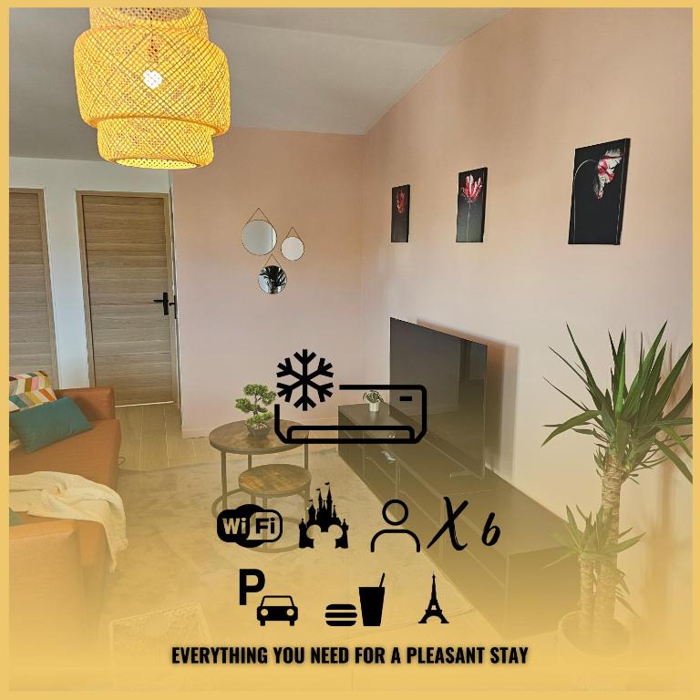 a living room with a table and a potted plant at L'écrin De Mouroux - Disney 20 min - Clim & Parking in Mouroux