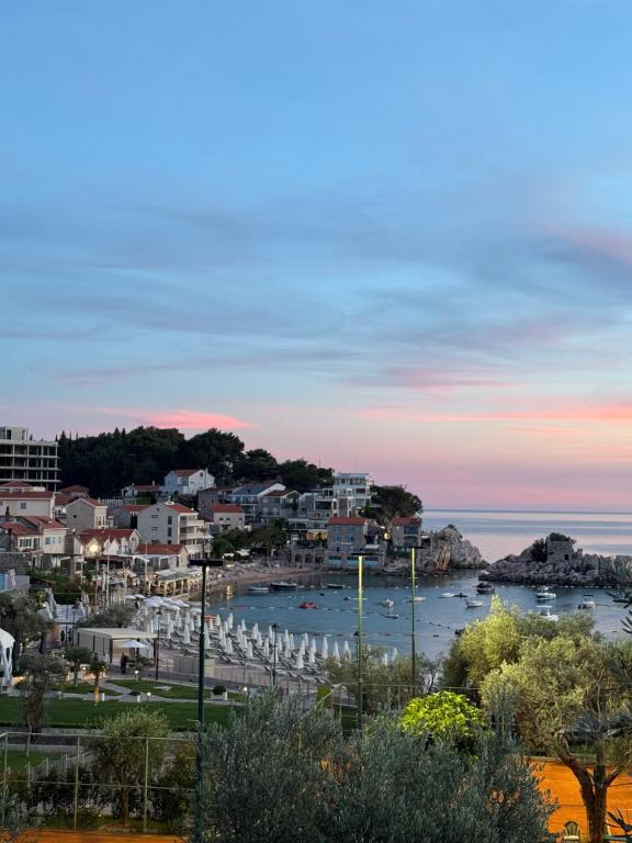 a view of a city with boats in the water at Azure Residence in Pržno