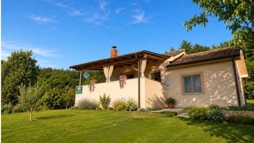 a house with a green yard at Terra Verde in Račički Brijeg