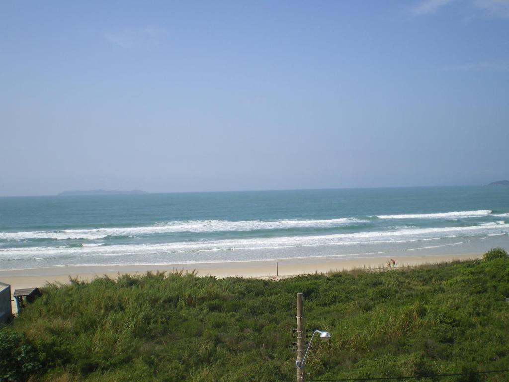 a view of a beach with the ocean at Praia de Mariscal a 50 metros do mar in Bombinhas