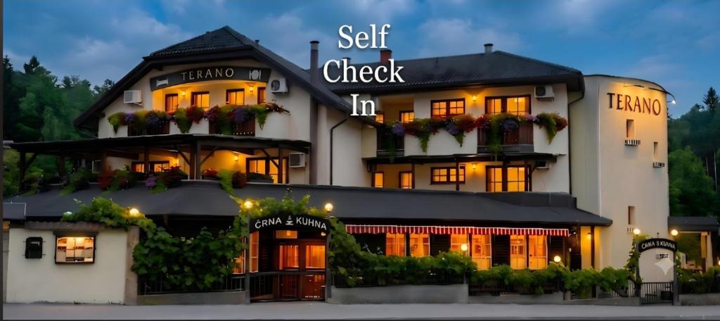 a hotel with a sign that reads self check in at Terano Urban Lodge in Maribor in Maribor