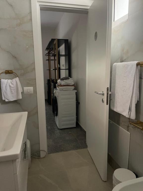 a bathroom with a sink and a toilet and a sink at Durres Garden Stay in Durrës