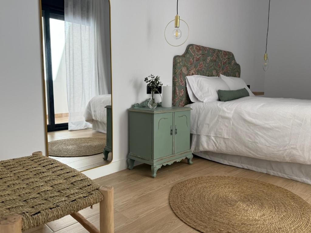 a bedroom with a bed and a mirror at Apartamento Casa Nela 3 in Medellín