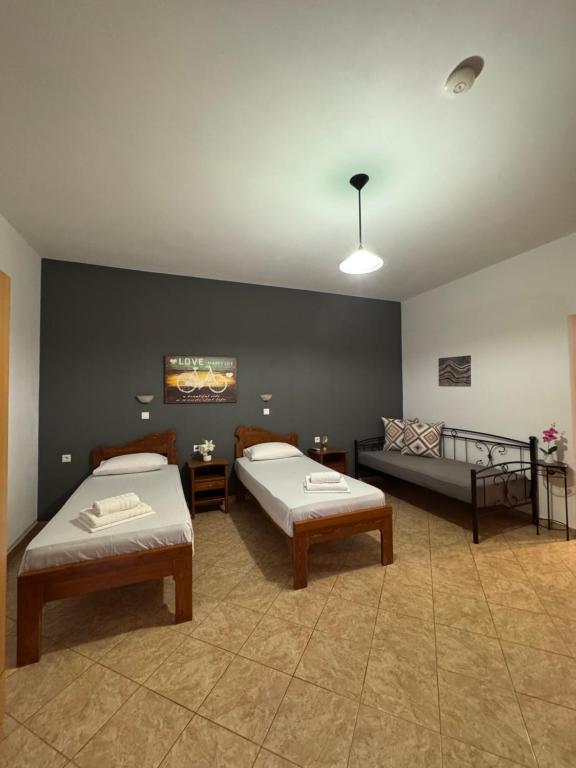 a large room with two beds and a couch at Dream Catcher 5 in Agia Theodoti