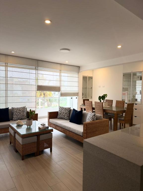 a living room with a couch and a table at Punta Hermosa Apartment in Punta Hermosa