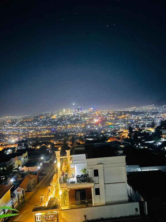 a view of a city at night with lights at Kigali Legacy Villa Homes in Kigali