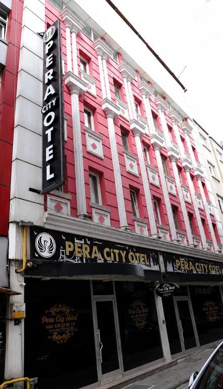 a red and white building with a sign on it at Pera City Otel in Samsun