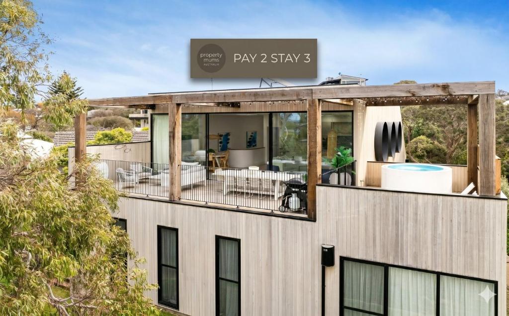 an image of a building with a view of the yard at Santorini Blue Sorrento with heated spa and stunning views in Sorrento