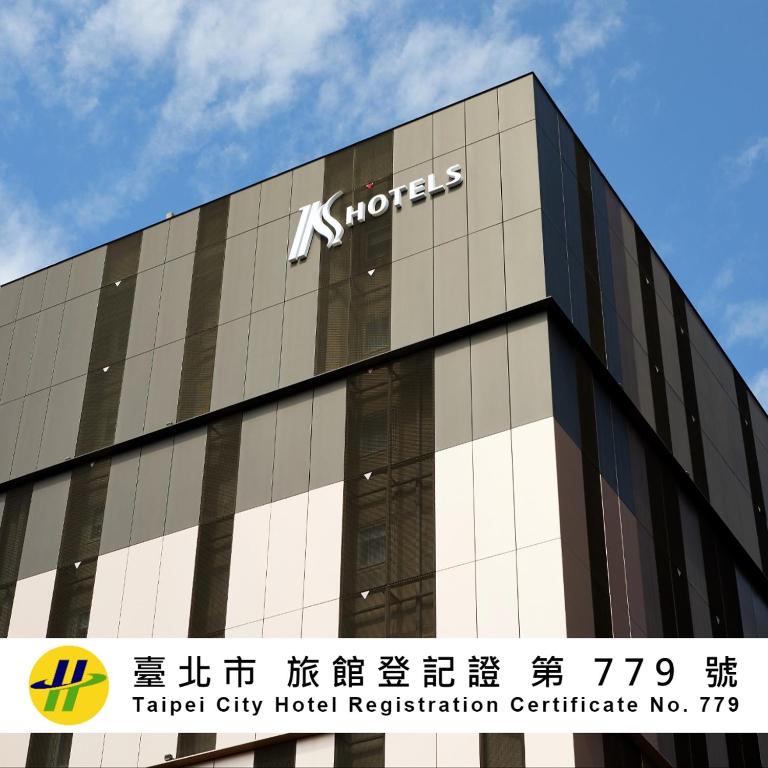 a building with a sign on the side of it at K Hotel Taipei Nanjing in Taipei