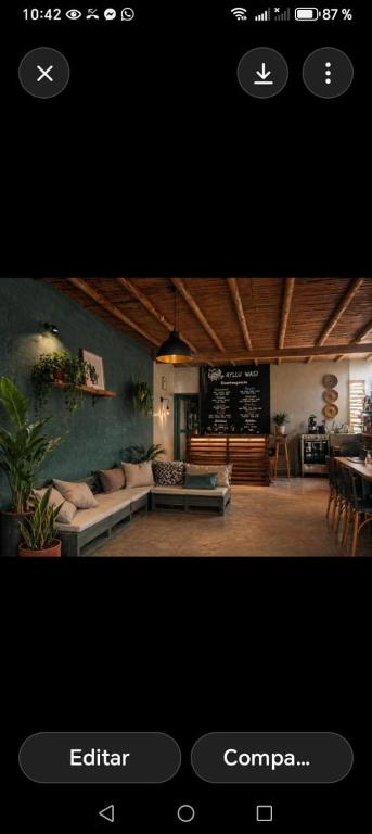 a picture of a living room with a couch at dondelachatahostel in Máncora