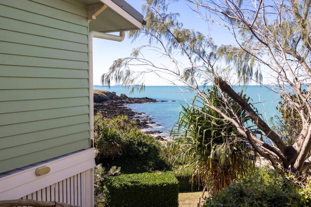 a view of the ocean from the side of a house at Silver Waters | Private Cove | Ocean Views in Zilzie