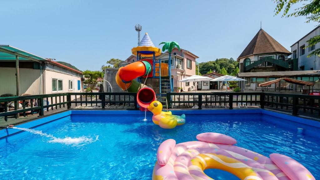 a swimming pool with a inflatable at Chuncheon Remember Pet Pension in Chuncheon