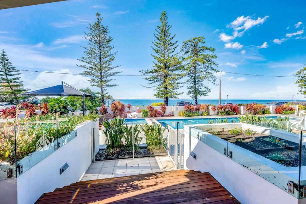 a view of the pool from the balcony of a house at C Bargara Unit 101 in Bargara