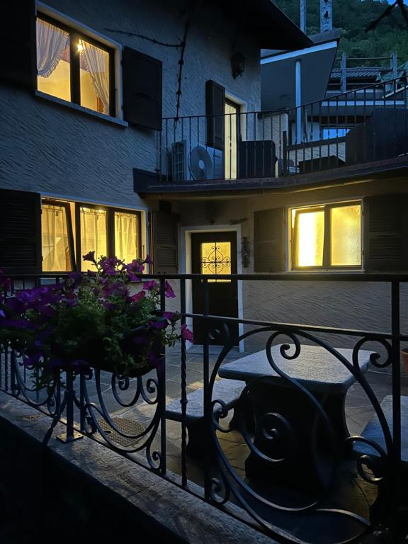a table and chairs in front of a building at Pancuc Charme & Relax in Gordevio