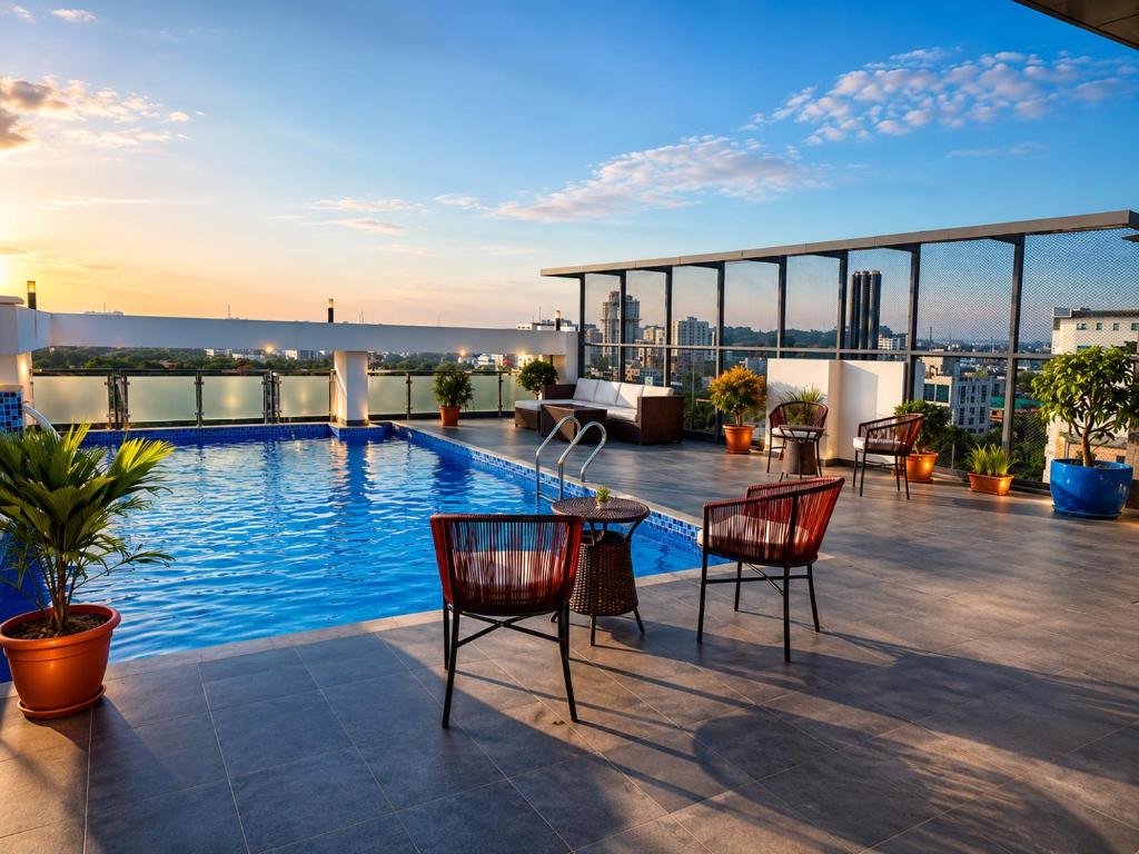 a rooftop patio with a swimming pool on a building at Sylhet Paradise Inn in Sylhet