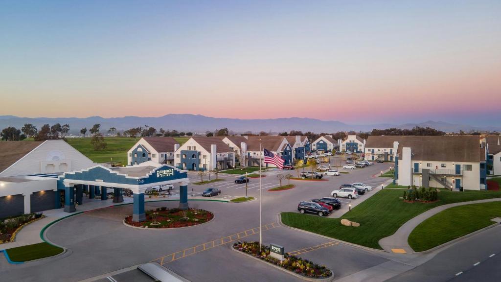 an aerial view of a town with cars parked in a parking lot at Staybridge Suites Oxnard - River Ridge by IHG in Oxnard