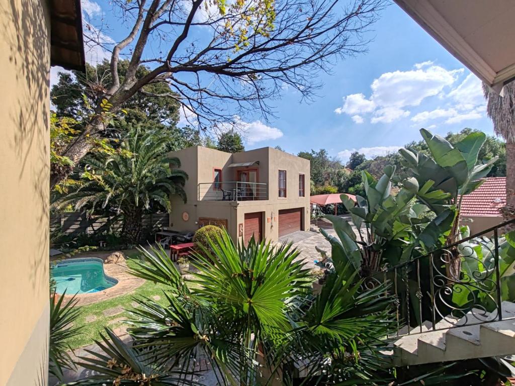 a view of a house from a balcony at Moonflower Cottages in Johannesburg