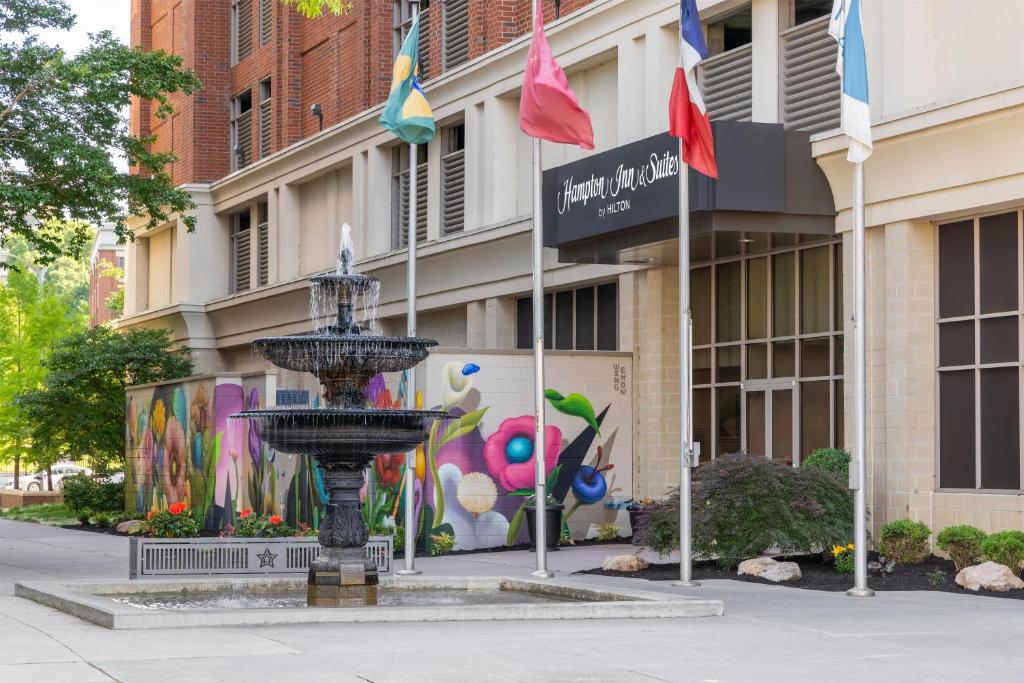 a fountain in front of a building with a mural at Hampton Inn & Suites - Roanoke-Downtown, VA in Roanoke