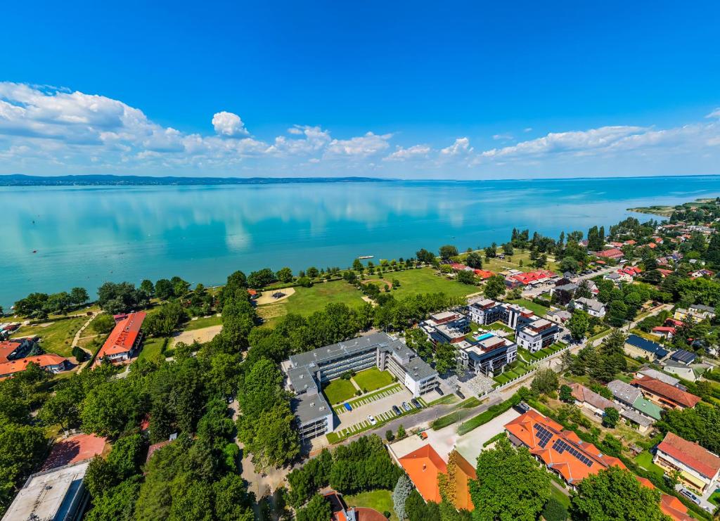an aerial view of a school next to the water at Sunshine Homes Zamárdi in Zamárdi
