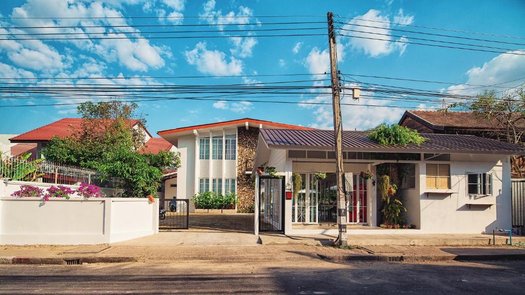 a house on the corner of a street at Mammoth Boutique Hotel in Chiang Mai