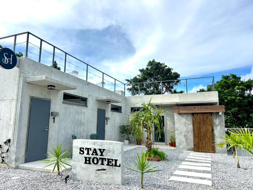 a house with a sign that reads stay hotel at Stäy Hotel Nakijin in Nakijin