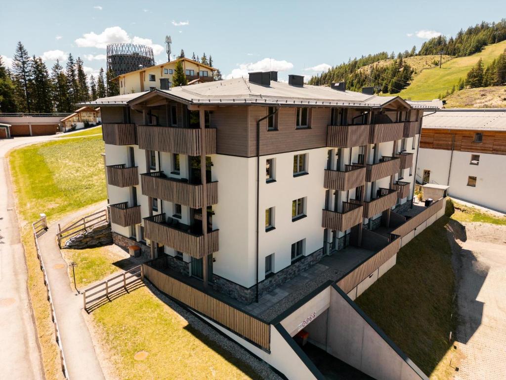 an aerial view of a building with wooden balconies at Haus Tauernblick am Katschberg in Katschberghöhe